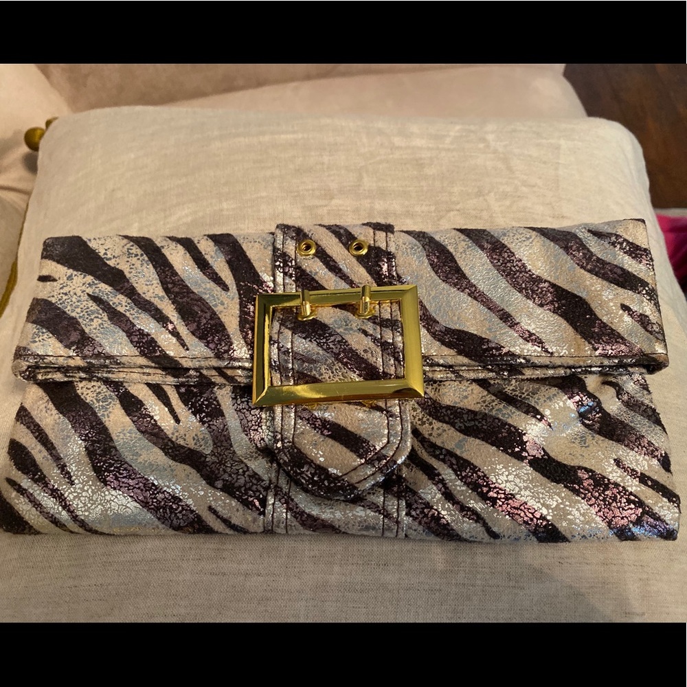 Metallic animal print foldover clutch.